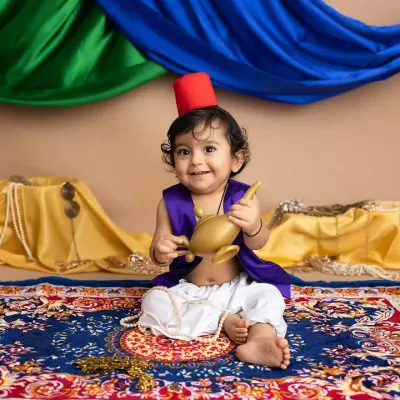 Every smile is a wish come true with this little Aladdin! This themed sitter session is complete with a magic lamp, a flying carpet, and a whole lot of charm.