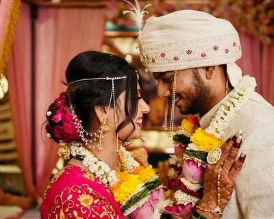 An intimate moment between the bride and groom. Her soft glam makeup and his natural, polished look are in perfect harmony.