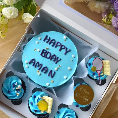 A closer look at the tennis-themed bento box, showing the mini cake and the detailed cupcake toppers.