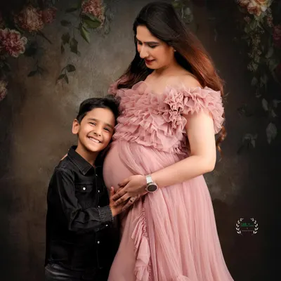 A beautiful moment between a mother, her son, and her baby bump. Capturing the excitement of a big brother-to-be is so special.