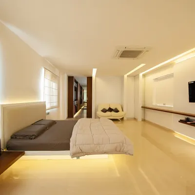 a minimalist floating bed frame with integrated headboard and subtle under-lighting, creating a serene and spacious atmosphere… the attached cantilevered nightstand continues the clean, architectural lines.