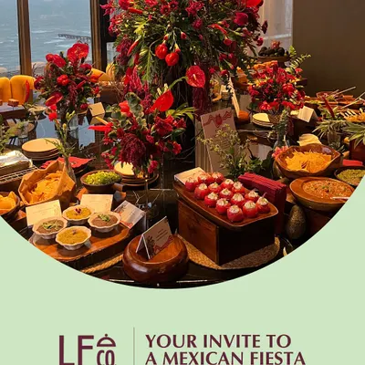 Your invitation to a Mexican Fiesta. We create vibrant, flavor-packed spreads that capture the spirit of Mexico, complete with bold red floral arrangements and a menu full of classics like tacos, nachos, and zesty salsas.