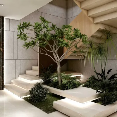 As a centerpiece of our biophilic approach, this indoor garden is built directly into the staircase. It transforms a simple transitional area into a serene, green experience, demonstrating how nature can be woven into the very fabric of a home.