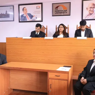 Serving as a judge in the final round of a moot court competition at The NorthCap University. I was impressed by the students' compelling arguments and confident courtroom demeanor.