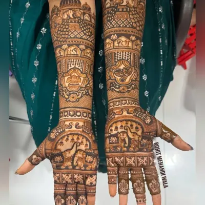 This is a classic Rajasthani bridal design, filled with traditional figures. It includes elephants, peacocks, and palace architecture, with every space filled with intricate patterns.