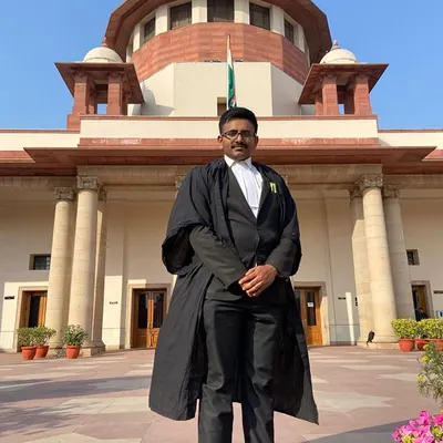 In my robes outside the Supreme Court of India. Representing clients at the apex court requires the highest level of diligence and preparation.