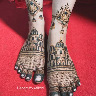Your bridal look isn't complete without beautiful mehendi on your feet. I designed this intricate pattern featuring architectural domes and delicate lotus danglers to perfectly complement the bride's overall look.