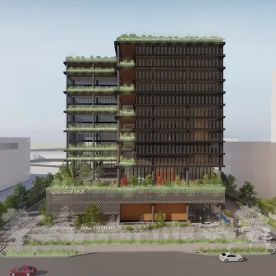 This is the full exterior render of MSR Tower in Bangalore. The design breaks down the building's mass with cascading green terraces and a visually distinct podium level, creating a workplace that breathes and connects with the city's garden identity.