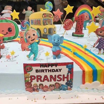 Bring the fun of nursery rhymes to the party with this vibrant Cocomelon sheet cake. It's packed with edible characters, a rainbow road, and colorful details, making it a showstopper for any toddler's first birthday.