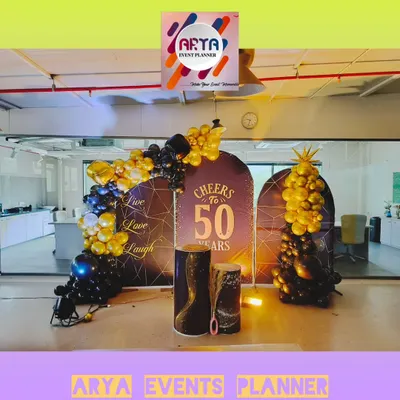 We designed this elegant photo backdrop for Paras Defence's 50th anniversary celebration in their Nerul office. The theme "Cheers to 50 Years" was brought to life with custom panels and sophisticated balloon art.