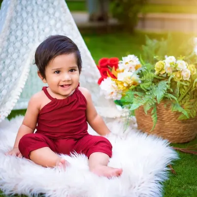 A beautiful sitter session in a lovely outdoor setting. The natural light and greenery create a soft and dreamy feel, perfect for capturing your baby's sweet personality.