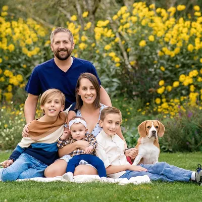 A perfect family portrait with everyone, including their handsome beagle, nestled among a field of yellow summer flowers. Capturing big, happy groups like this is one of my greatest joys.
