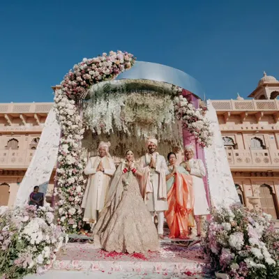 A stunning wide shot of the wedding mandap set against the Welcomhotel Khimsar Fort. This image showcases our ability to capture the scale and grandeur of a royal Rajasthani wedding.