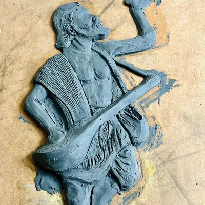 The beginning of a 3D mural. Here, I have sculpted the main figure of Kanaka Dasa onto a board using clay. This is the foundational layer, capturing his dynamic pose and emotion before any details are added.