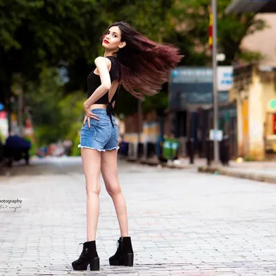 Capturing motion and energy on the streets of Bangalore. This full-length shot uses the empty street as a runway, creating a dynamic fashion photograph.