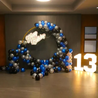 I provide large, light-up marquee numbers, like this number '13', perfect for milestone birthdays. They create a great photo opportunity and add a professional touch to your party decor.