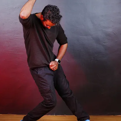 A signature GKStyle pose captured during a photoshoot. Dance is about creating powerful shapes and telling a story with your body.