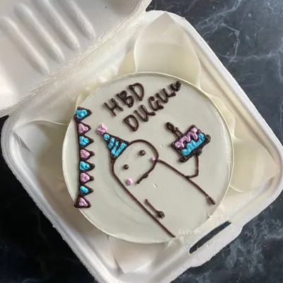 A cute hand-drawn character bento cake for a birthday. I love bringing your fun and quirky ideas to life on these mini cakes.