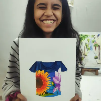 The pure joy of creating something you love. Bharti from our CB2 batch is all smiles with her vibrant T-shirt design, which beautifully combines a sunflower and a lotus.