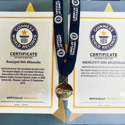 A proud moment for me. Here are my two official Guinness World Record certificates for participating in creating the largest display of crocheted Christmas decorations and the largest display of crochet mats.