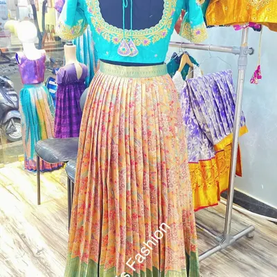This vibrant lehenga set was created from a single floral saree. I used the body for the pleated skirt and designed a custom embroidered blouse to match.