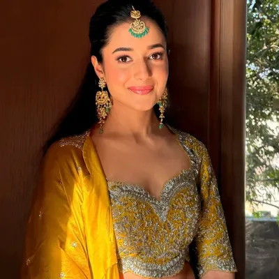 A perfect example of subtle glam for a festive daytime event. The makeup provides just the right amount of glow to complement a bright yellow Haldi outfit.
