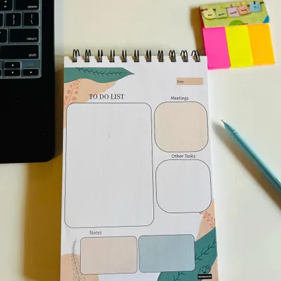 My undated 'To Do List' pad, perfect for organizing your tasks, meetings, and notes. It's spiral-bound and comes with a free pen.
