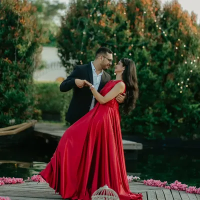 A fairytale dance on a wooden deck surrounded by flowers and fairy lights. This shot of Nikhil and Anisha in their formal attire is pure romance.