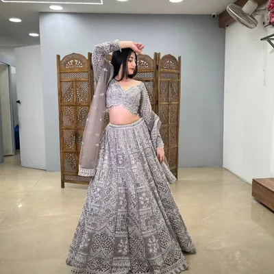 A full view of a grey lehenga with intricate white embroidery, a modern and sophisticated choice.