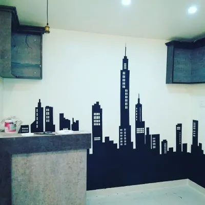 A sharp, black city skyline silhouette provides a striking contrast against a light wall. This is a popular choice for modern living areas, home offices, and commercial spaces.