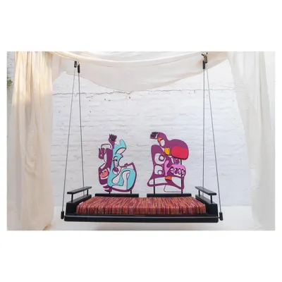 The 'Kaleidochaos' swing, a collaboration where we turned a functional furniture piece into interactive art. The modular backrests are our own sculptural creations, designed to be moved and reconfigured by the user.