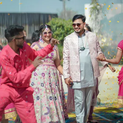 The grand entrance of the couple at their daytime Mehendi ceremony. I love capturing the energy of the moment, with friends and family dancing and celebrating alongside the bride and groom.