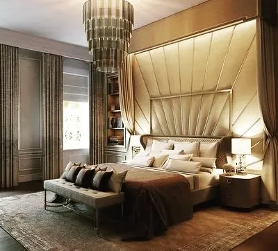 A masterclass in luxury bedroom design. This render showcases a floor-to-ceiling upholstered headboard, a stunning tiered chandelier, and integrated bookshelves, creating a space that feels like a suite in a five-star hotel.