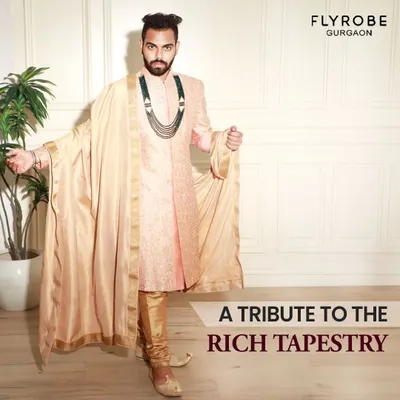 A tribute to the rich tapestry of Indian weddings. This groom looks regal in a peach-colored sherwani paired with a luxurious stole, showcasing a modern take on royal attire.