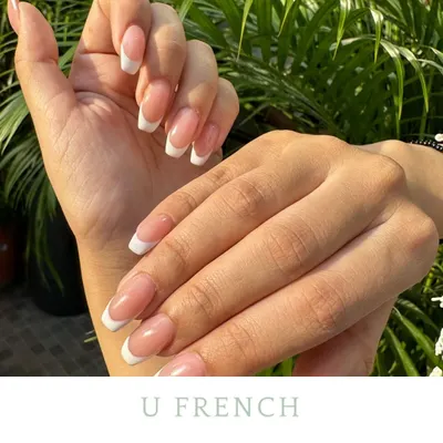 A classic U-shaped French manicure. This set features clean, traditional white tips on a perfectly shaped square nail, showing how timeless and elegant this style is.