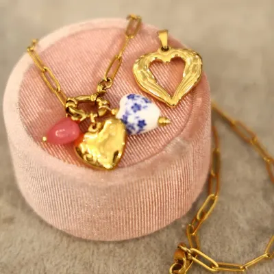 Say it with style. This Valentine's Day collection features delicate gold-plated chains and a variety of heart-shaped charms, including hammered gold and blue-and-white porcelain. It is the perfect personalized gift or self-love treat.
