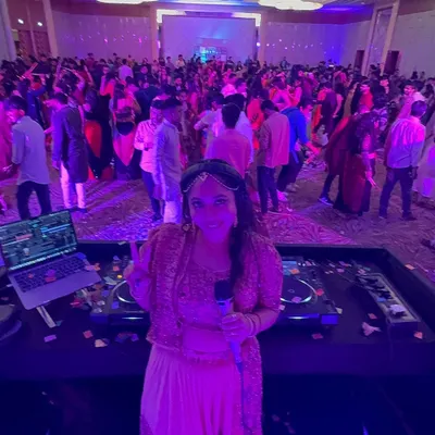 This is my view from the DJ deck, my happy place. I love looking out and seeing a massive crowd dancing and making memories at a vibrant Dandiya celebration.
