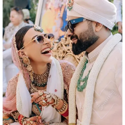The best moments are the ones filled with laughter. We love capturing these candid interactions between the couple, like this joyful shot of Mehak and Tarun, which radiate pure happiness.