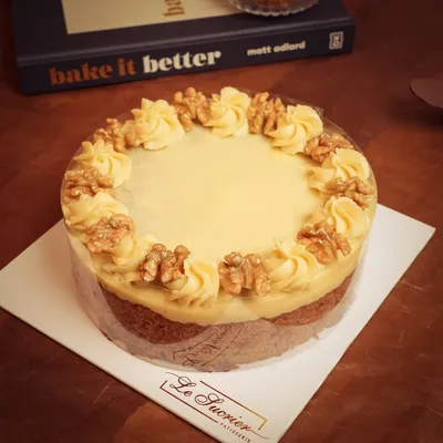 This classic Carrot Cake has it all: a moist crumb, warm spices, sweet carrot flavor, and crunchy walnuts, all topped with a rich cream cheese frosting.