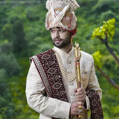 A classic portrait of a Himachali groom in his sherwani and intricately tied turban. I focus on capturing a look of strength and pride.