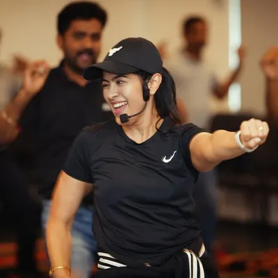 Leading a corporate Zumba class is about creating a shared experience. You can see the engagement and fun as the team follows along, breaking a sweat and smiling together.