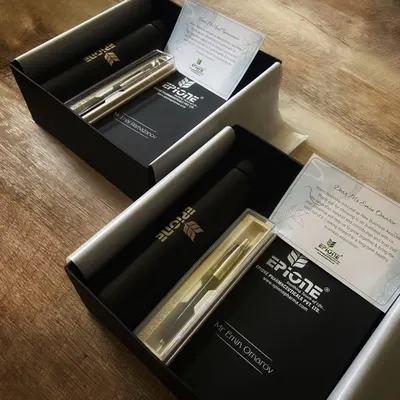 A client onboarding gift we curated for Epione Pharma. This sleek black box contains a personalized pen set, a branded flask, and a custom welcome note to build a strong professional relationship from day one.