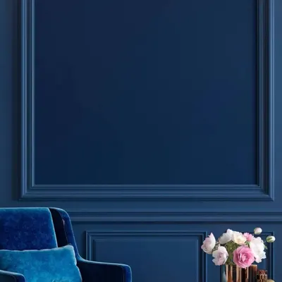 The deep, rich blue on this wall with decorative molding demonstrates the impact of a single, perfectly executed colour. Our focus on sharp cut-in lines and an even finish ensures a luxurious and high-end result.