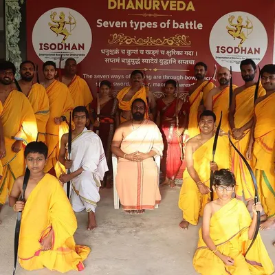 A group of newly certified Acharyas after completing their residential training. They hold their bows with pride, ready to take the teachings of Dhanurveda out into the world.