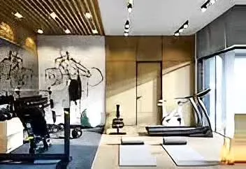 For this commercial gym, we created a dynamic and motivating environment using dramatic wall art and a mix of track and spot lighting. The layout strategically zones equipment for cardio, strength training, and floor exercises to ensure a safe and efficient workout flow.