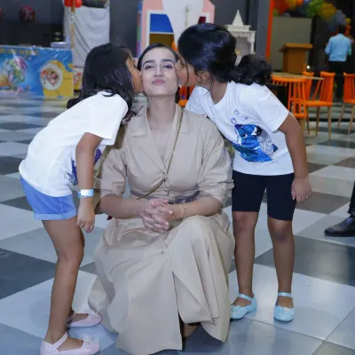 There's nothing better than a mother's love. This heartwarming moment captures the special bond between a mom and her children during a fun day out.