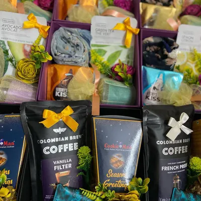 We create distinct wedding favors for all your guests, like this assortment for a recent celebration. This collection shows a mix of gifts for men and women, including premium coffee and post-shave balm alongside elegant scarves and skincare items, ensuring everyone receives a thoughtful and useful token of appreciation.