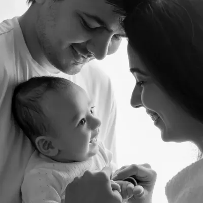 A classic black and white family photo, where the lack of color emphasizes the loving expressions and connection.