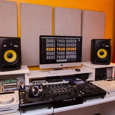 This is one of our dedicated DJ training stations. It features a full Pioneer DJ setup with CDJs and a mixer, paired with KRK studio monitors for accurate sound reproduction, so you learn on the same gear used in clubs worldwide.