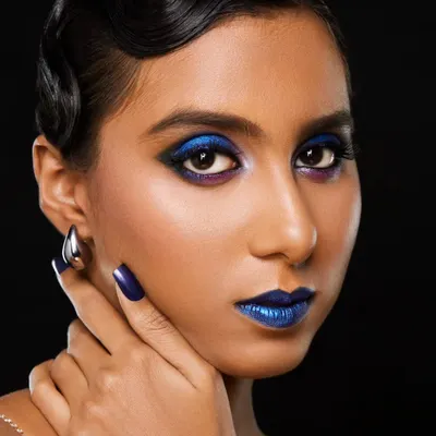 This is a look for the bold and adventurous. I combined a striking metallic blue lip with a deep blue smokey eye and styled the hair in classic 1920s finger waves for a dramatic, high fashion result.